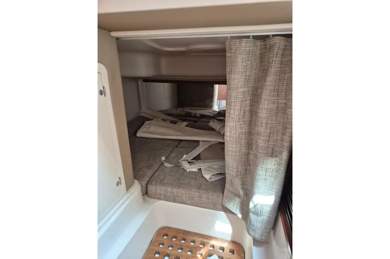 Rising Sun Yacht Photos Pics 2018 Grady-White Express 330 cabin interior with bed and curtain.