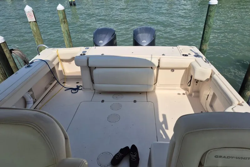 Rising Sun Yacht Photos Pics 2018 Grady-White Express 330 boat interior with twin engines at dock.