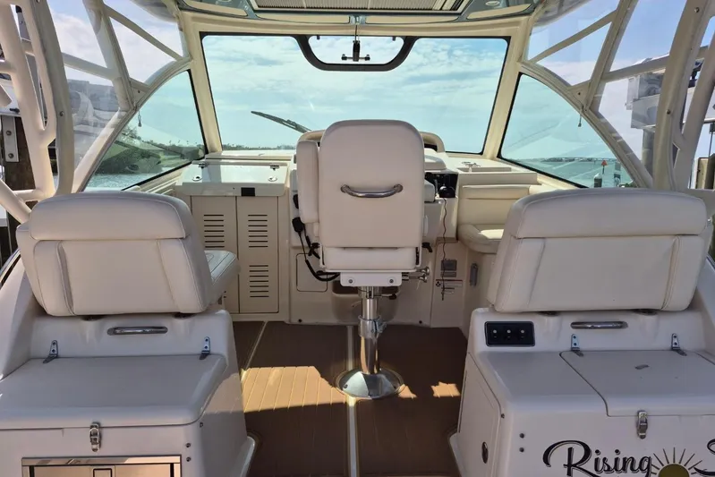 Rising Sun Yacht Photos Pics 2018 Grady-White Express 330 boat interior with white seating and helm view.