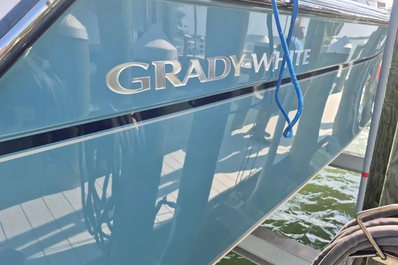 Rising Sun Yacht Photos Pics 2018 Grady-White Express 330 boat docked with blue hull and logo.