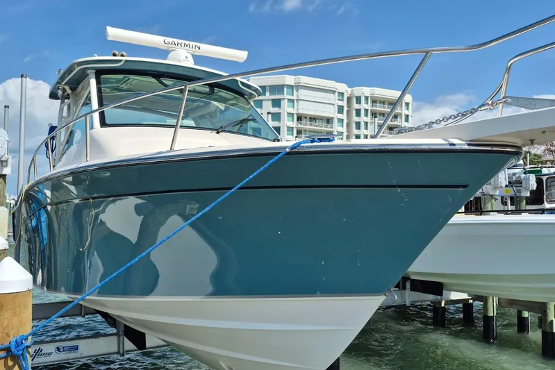 Rising Sun Yacht Photos Pics 2018 Grady-White Express 330 boat docked, featuring sleek design and Garmin equipment.