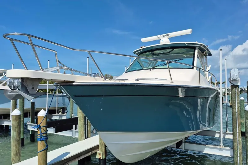 Rising Sun Yacht Photos Pics 2018 Grady-White Express 330 boat docked, featuring sleek design and Garmin equipment.