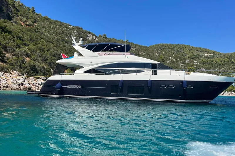  Yacht Photos Pics Luxurious 2012 Princess 72 Motor Yacht cruising in scenic coastal waters.
