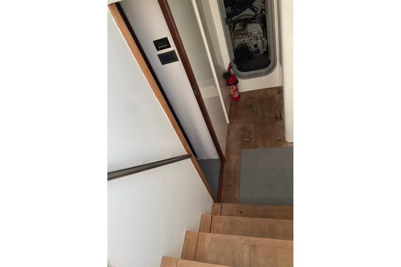  Yacht Photos Pics Interior of 2012 Princess 72 Motor Yacht with wooden stairs and engine room access.
