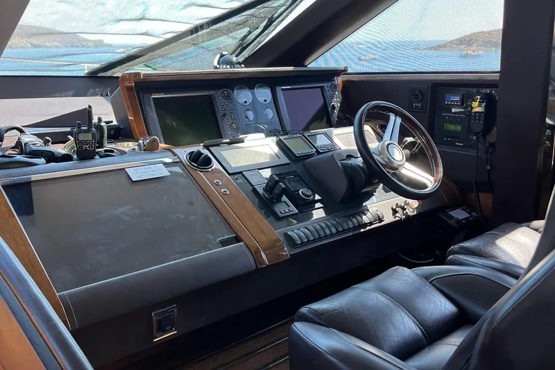  Yacht Photos Pics Cockpit of 2012 Princess 72 Motor Yacht with navigation controls and leather seating.