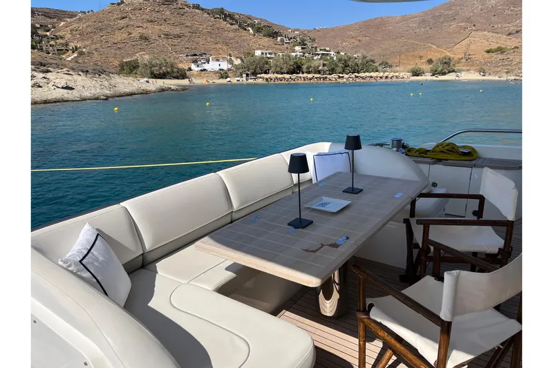  Yacht Photos Pics Luxurious seating area on 2012 Princess 72 Motor Yacht, overlooking serene coastal waters.