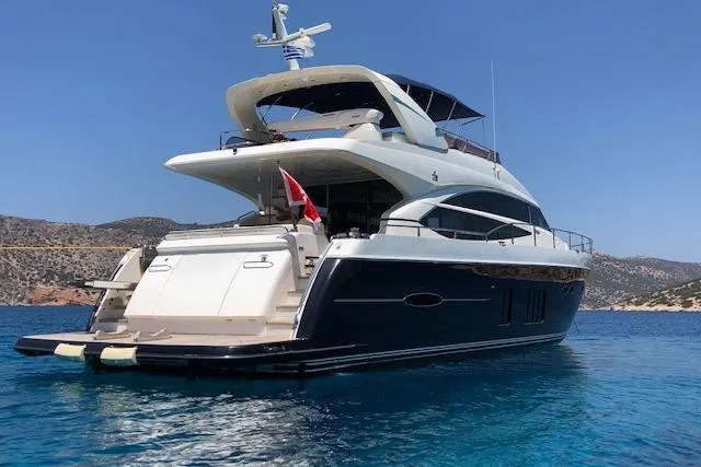  Yacht Photos Pics 2012 Princess 72 Motor Yacht on clear blue water, showcasing sleek design and luxury features.