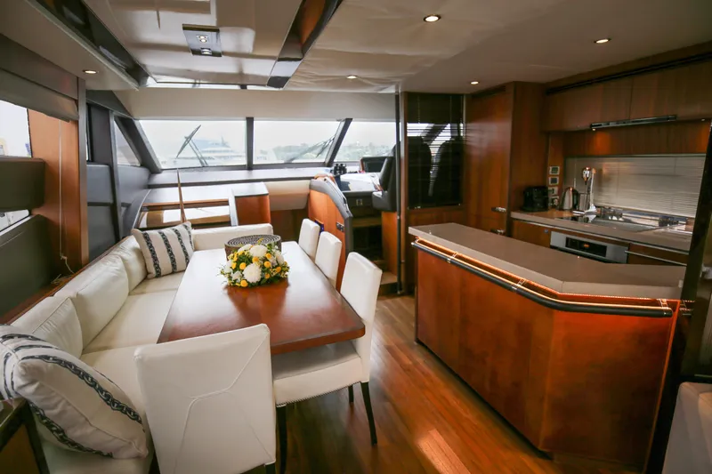  Yacht Photos Pics Luxurious interior of 2012 Princess 72 Motor Yacht with elegant dining and kitchen area.