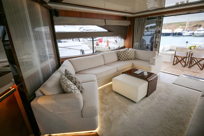  Yacht Photos Pics Luxurious interior of 2012 Princess 72 Motor Yacht with elegant seating and marina view.