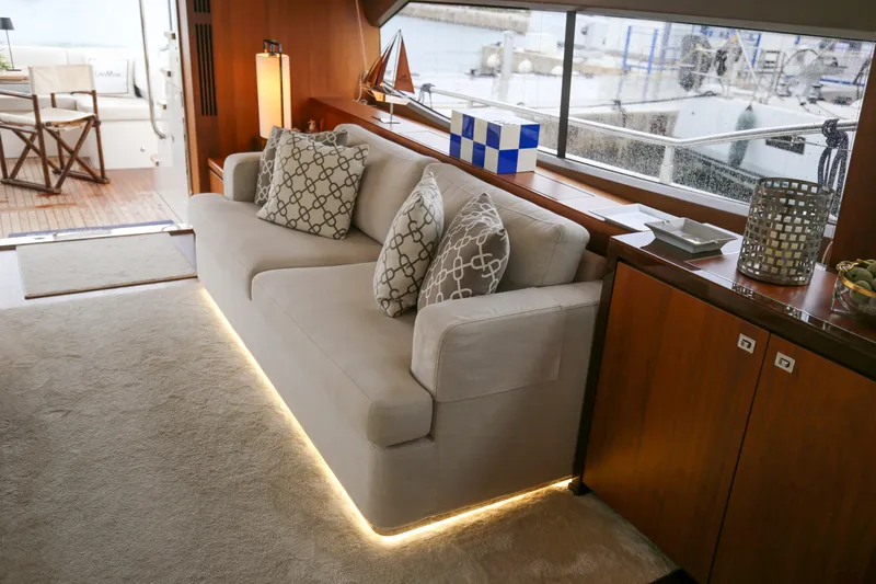  Yacht Photos Pics Luxurious interior of 2012 Princess 72 Motor Yacht with elegant sofa and nautical decor.