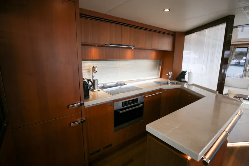  Yacht Photos Pics Luxurious kitchen interior of 2012 Princess 72 Motor Yacht with modern amenities.