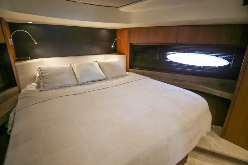  Yacht Photos Pics Luxurious bedroom interior of 2012 Princess 72 Motor Yacht with elegant bedding and lighting.
