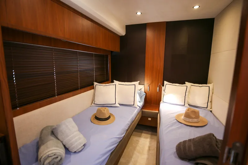  Yacht Photos Pics Luxurious twin cabin in 2012 Princess 72 Motor Yacht with cozy bedding and decor.