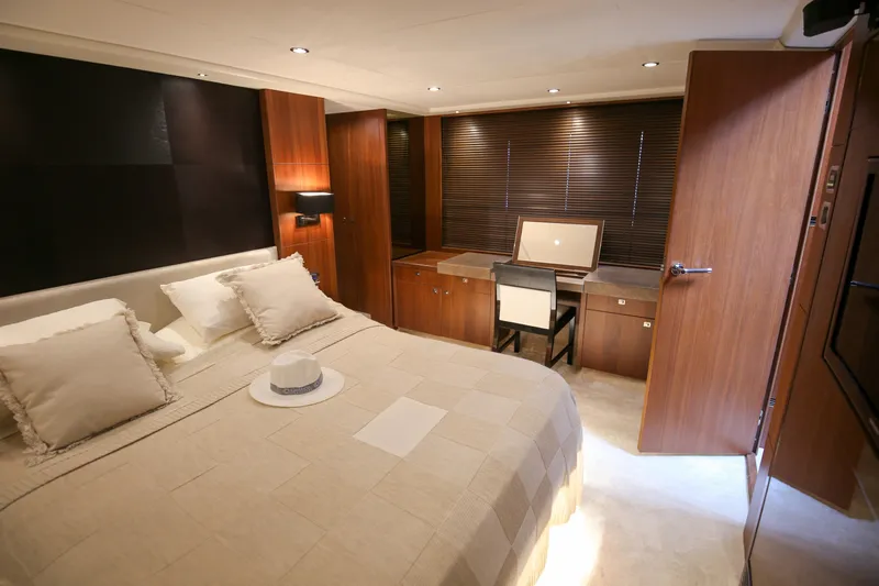  Yacht Photos Pics Luxurious bedroom interior of 2012 Princess 72 Motor Yacht with elegant furnishings.