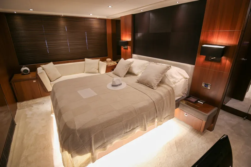  Yacht Photos Pics Luxurious bedroom interior of 2012 Princess 72 Motor Yacht with elegant furnishings.