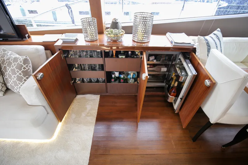  Yacht Photos Pics Luxurious interior of 2012 Princess 72 Motor Yacht with open bar cabinet.