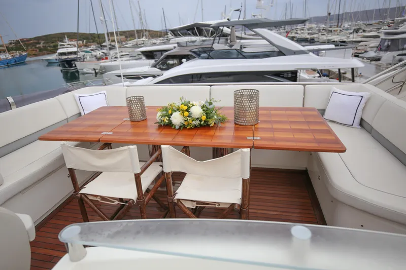  Yacht Photos Pics Luxurious 2012 Princess 72 Motor Yacht deck with elegant dining setup.