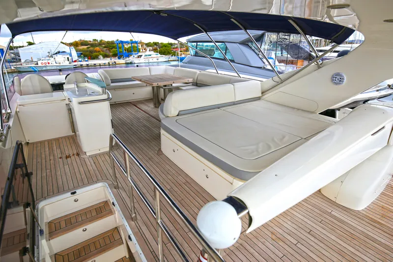  Yacht Photos Pics Luxurious 2012 Princess 72 Motor Yacht with spacious deck and elegant seating area.