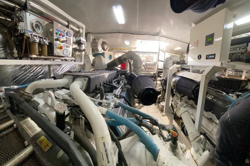  Yacht Photos Pics Engine room of a 2012 Princess 72 Motor Yacht, showcasing machinery and equipment.