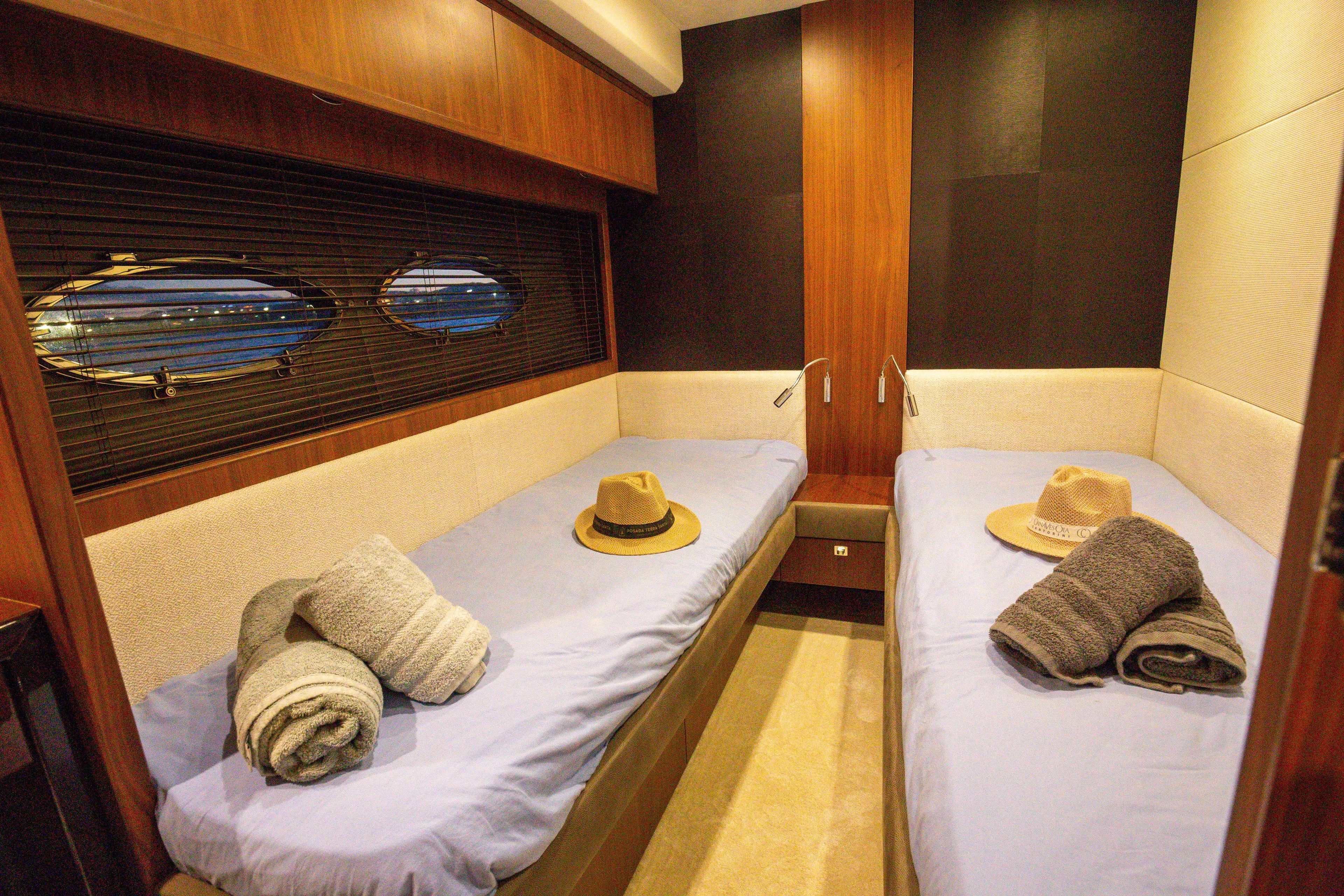  Yacht Photos Pics Luxurious twin cabin interior of 2012 Princess 72 Motor Yacht with porthole view.