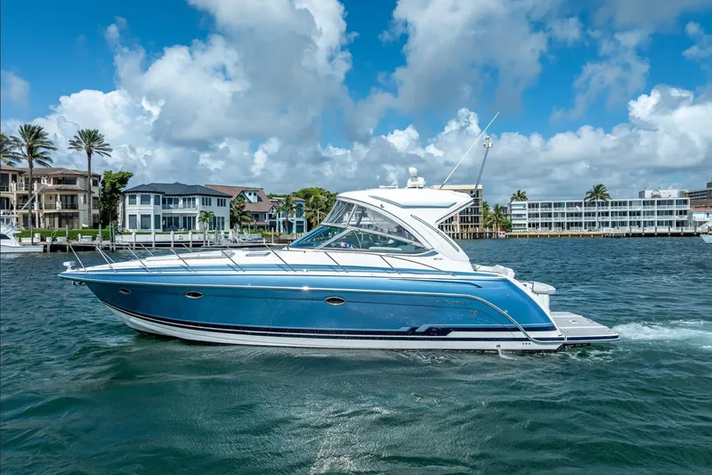  Yacht Photos Pics 2022 Formula 40 Performance Cruiser on water, with coastal buildings in background.