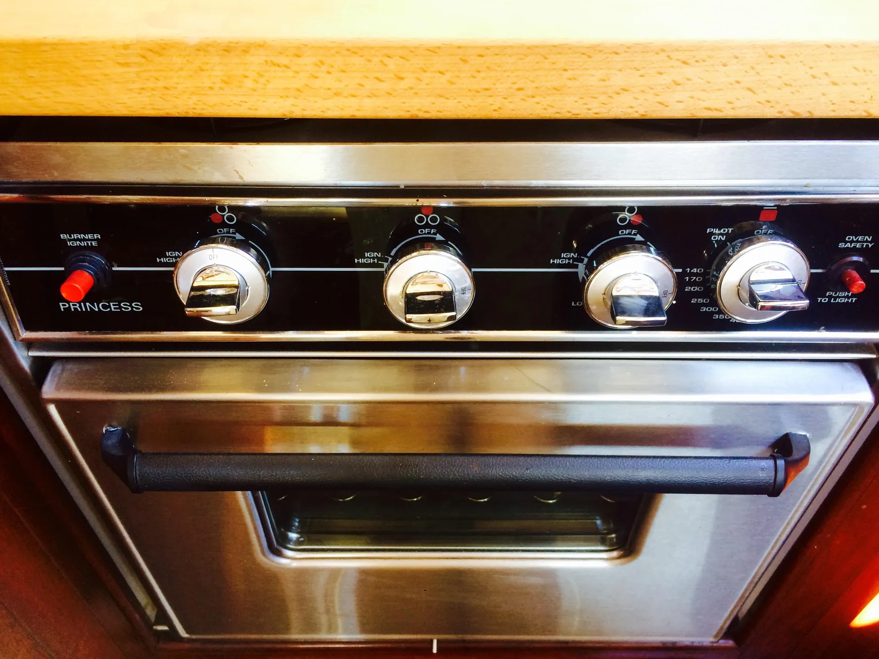 Stainless steel oven with control knobs, labeled "Princess," in a 1971 Formosa 41.