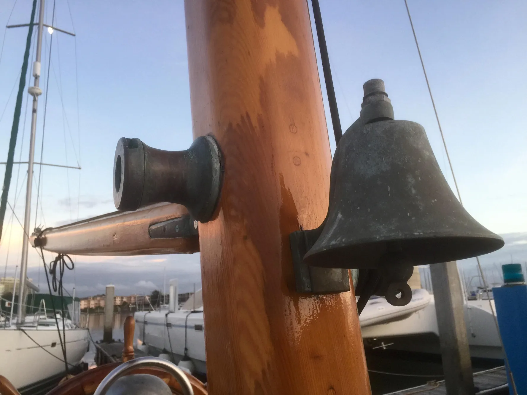 Vintage Formosa 41 sailboat mast with bell, docked at marina, 1971 model.