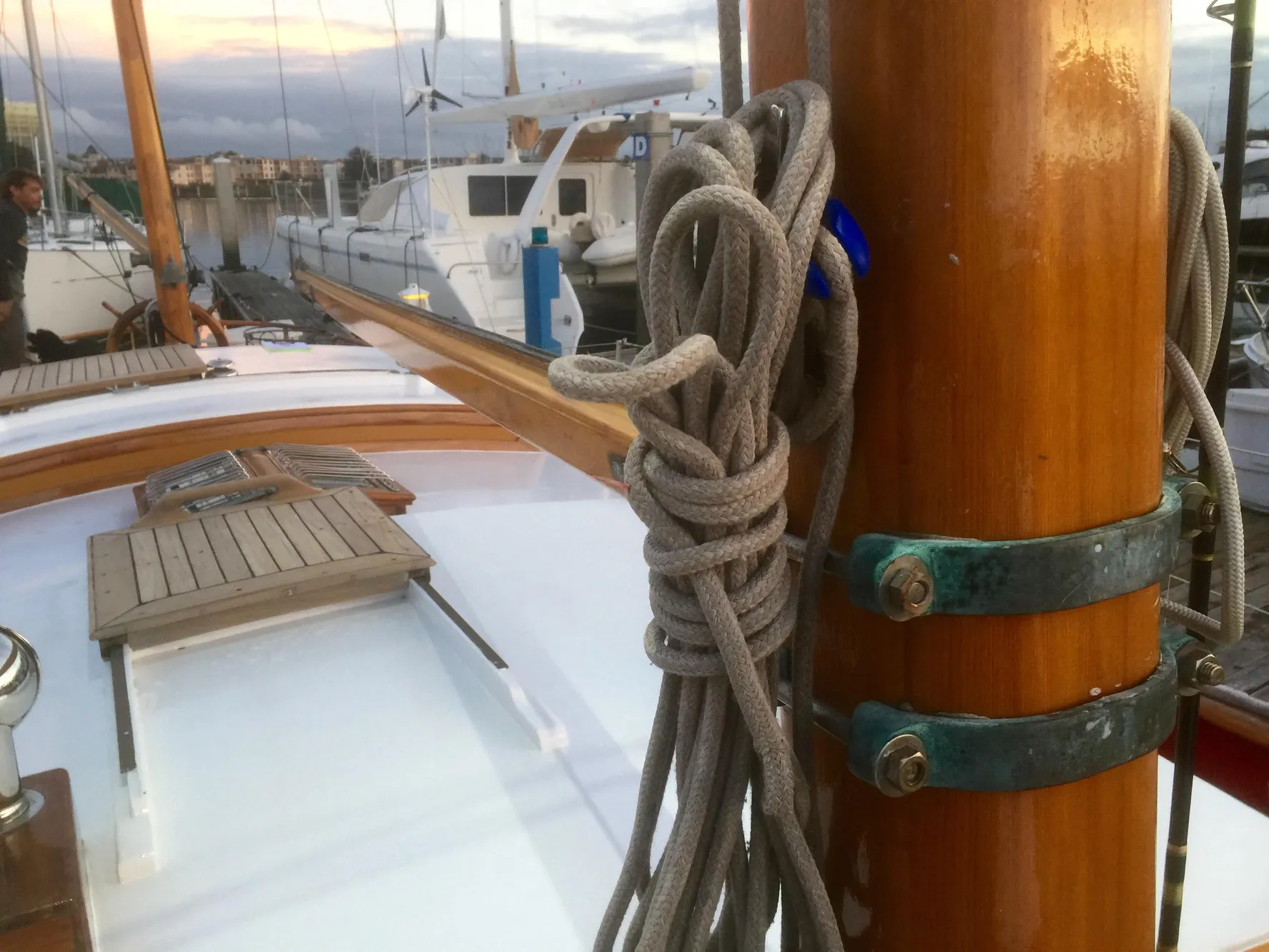 1971 Formosa 41 sailboat deck with coiled rope and wooden mast.