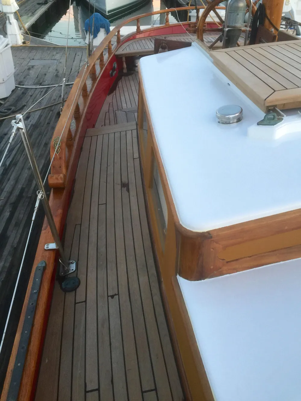 1971 Formosa 41 sailboat deck with wooden details and white cabin top.