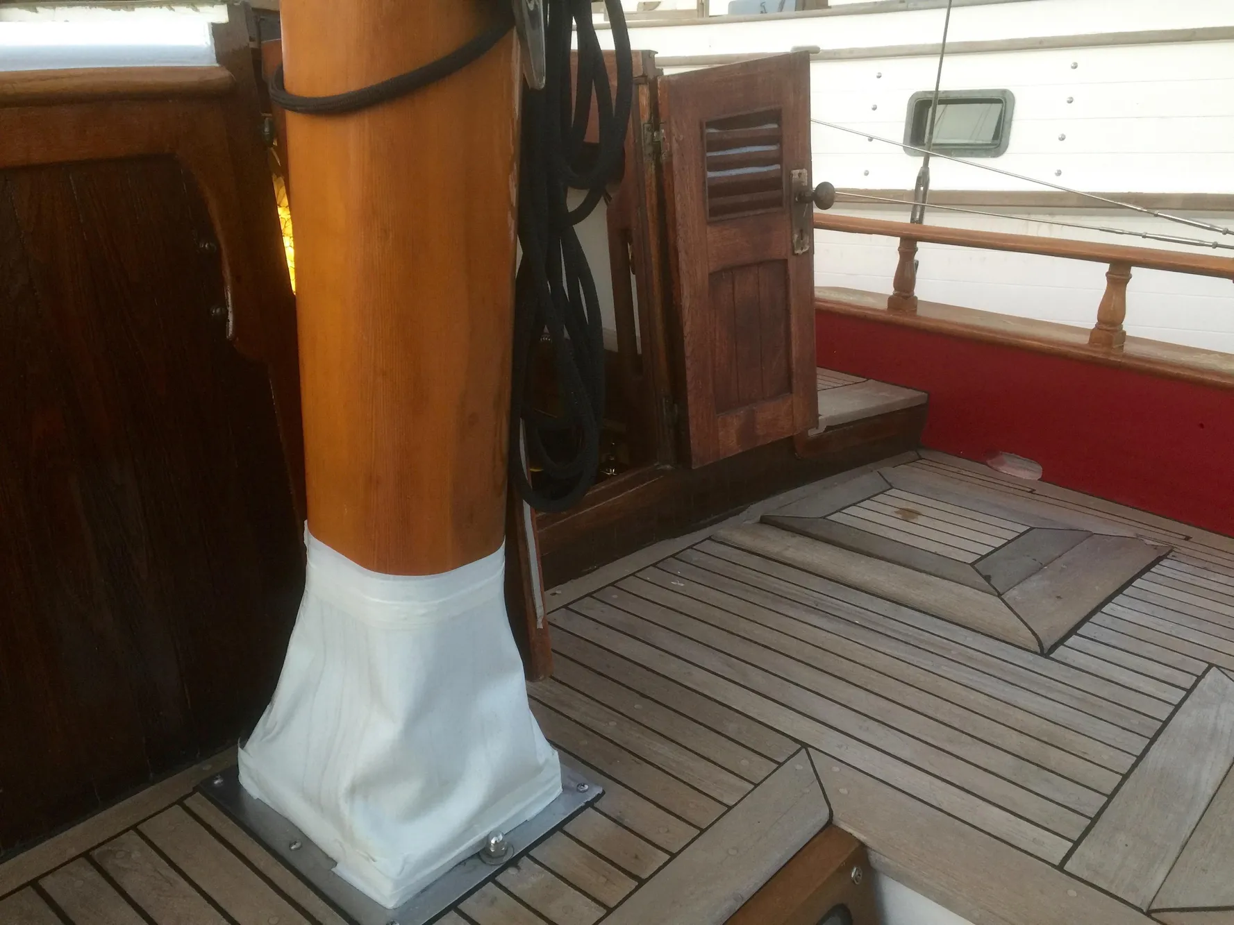 1971 Formosa 41 sailboat deck with wooden mast and hatch.