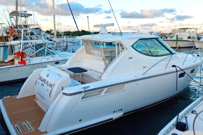 Escape Plan Yacht Photos Pics 2008 Tiara Yachts 4300 Sovran docked at marina, featuring sleek white design.