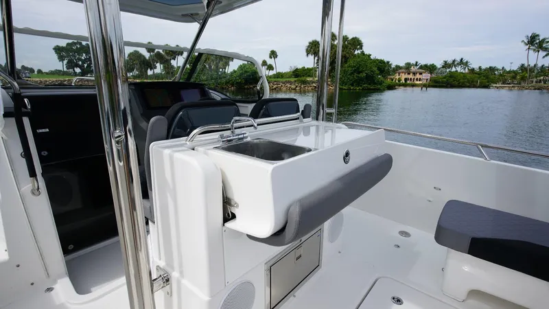 In-stock 2024 Nimbus T9 #143 Yacht Photos Pics 2024 Nimbus Tender 9 #143 boat interior with sink and seating area.