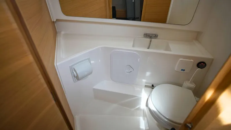 In-stock 2024 Nimbus T9 #143 Yacht Photos Pics 2024 Nimbus Tender 9 #143 boat bathroom with toilet and sink.