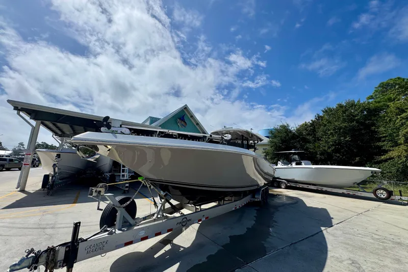  Yacht Photos Pics 2020 Fountain 38 Tournament Edition boat on trailer under blue sky.