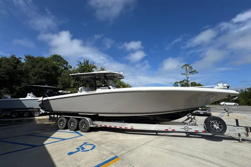  Yacht Photos Pics 2020 Fountain 38 Tournament Edition boat on trailer under clear blue sky.