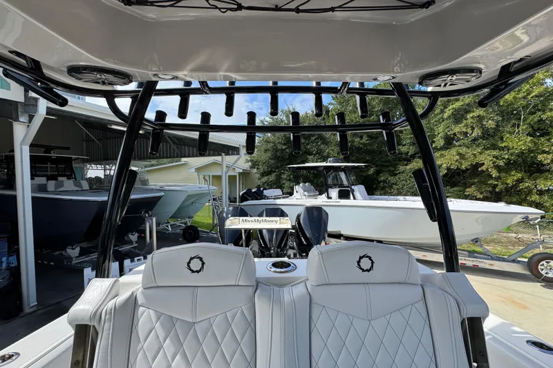  Yacht Photos Pics 2020 Fountain 38 Tournament Edition boat interior with rod holders and white seating.
