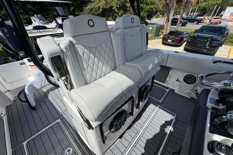  Yacht Photos Pics 2020 Fountain 38 Tournament Edition boat with luxurious white seating and modern interior design.