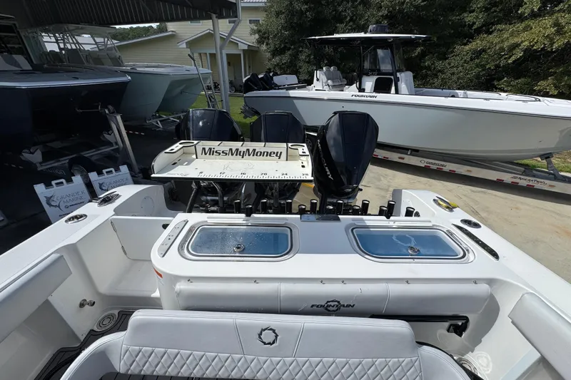  Yacht Photos Pics 2020 Fountain 38 Tournament Edition boat with triple engines, docked outdoors.