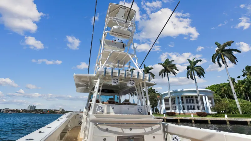 Strait To Voicemail Yacht Photos Pics 2018 HCB 53 Sueños boat cruising near waterfront homes and palm trees.