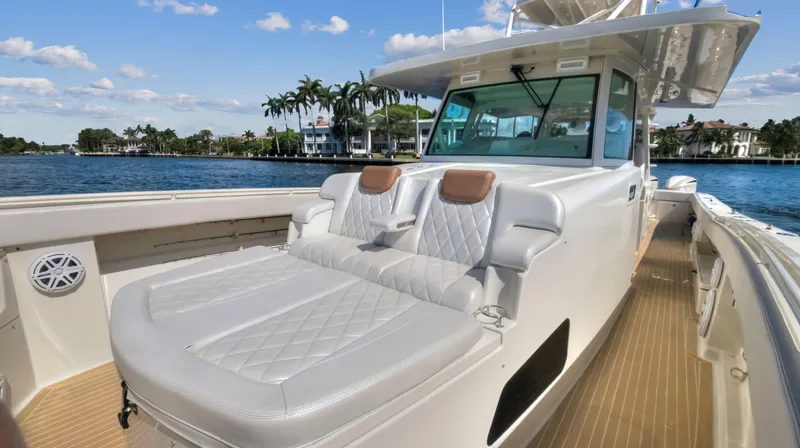 Strait To Voicemail Yacht Photos Pics 2018 HCB 53 Sueños luxury boat with cushioned seating on deck.