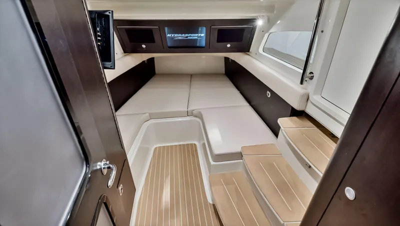 Strait To Voicemail Yacht Photos Pics 2018 HCB 53 Sueños cabin interior with modern design and wooden steps.