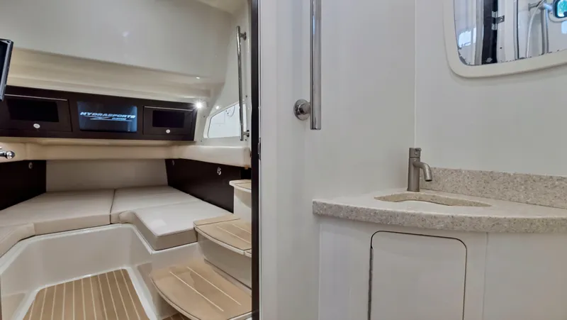 Strait To Voicemail Yacht Photos Pics Interior cabin of 2018 HCB 53 Sueños boat with seating and sink.