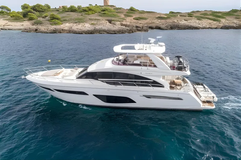  Yacht Photos Pics Luxurious 2019 Princess F70 yacht cruising near rocky coastline.
