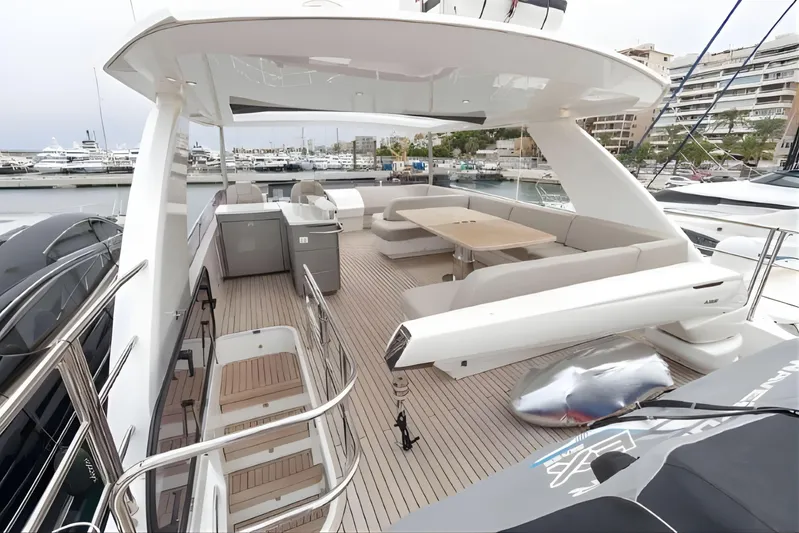  Yacht Photos Pics Luxurious 2019 Princess F70 yacht deck with seating and marina view.