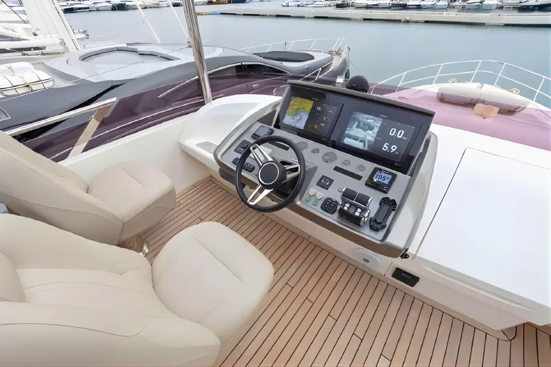  Yacht Photos Pics Luxurious 2019 Princess F70 yacht helm with modern navigation controls and plush seating.
