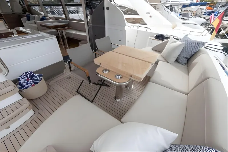  Yacht Photos Pics Luxurious seating area on 2019 Princess F70 yacht with elegant cushions and table.