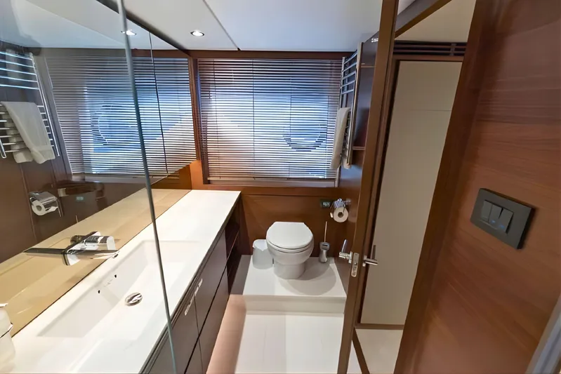  Yacht Photos Pics Luxurious bathroom interior on a 2019 Princess F70 yacht, featuring modern fixtures and wooden accents.