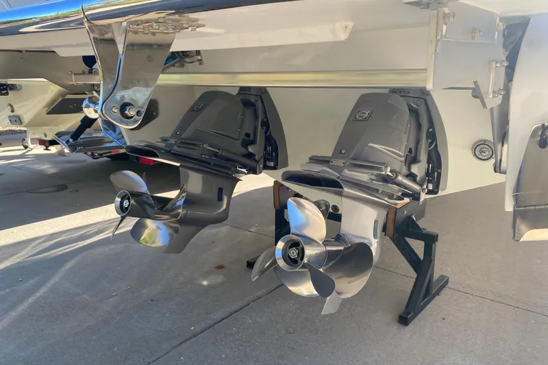  Yacht Photos Pics 2022 Cobalt R35 boat with dual propellers on a concrete surface.