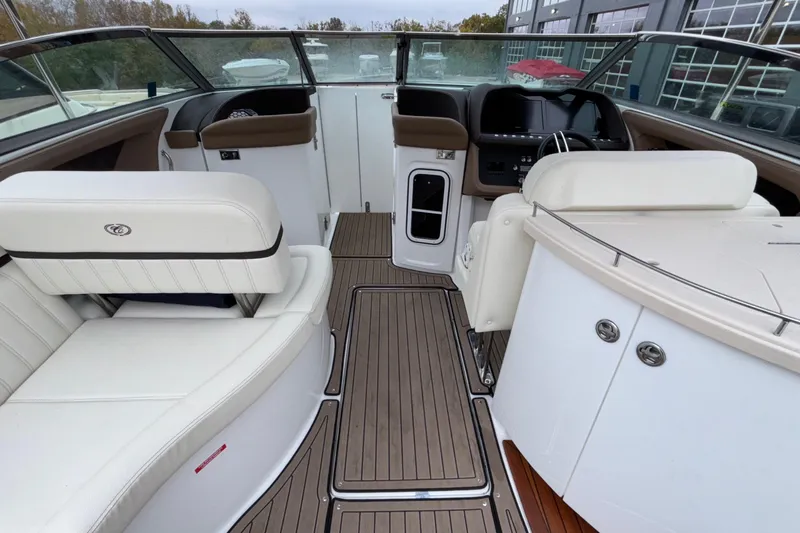  Yacht Photos Pics Interior of 2022 Cobalt R35 boat with white seating and wood flooring.
