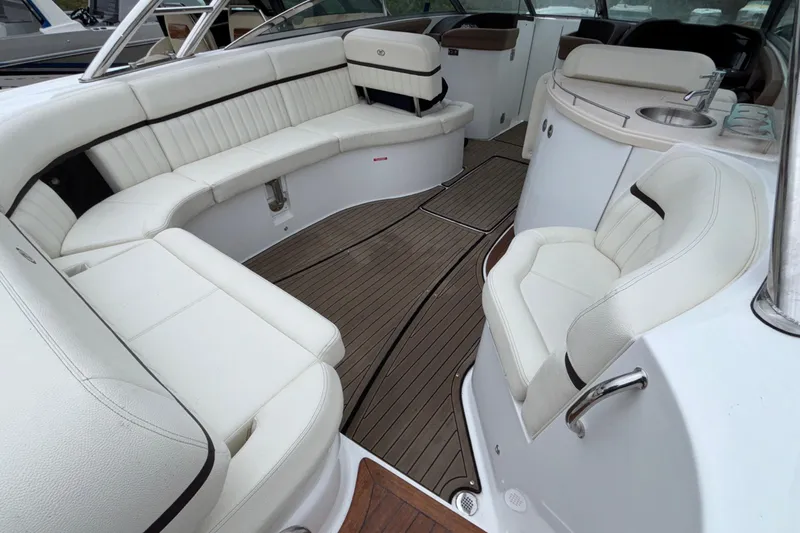  Yacht Photos Pics Luxurious interior of 2022 Cobalt R35 boat with white seating and wood flooring.